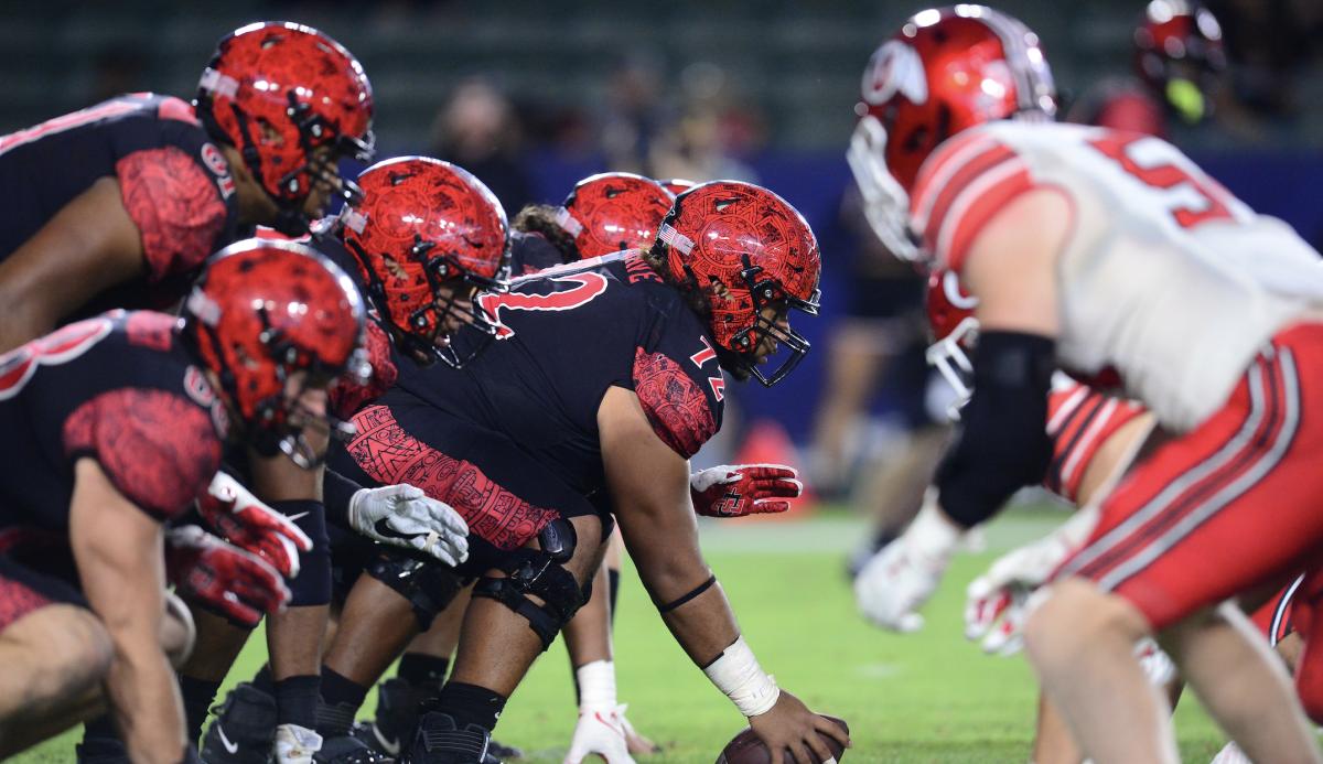 San Diego State Aztecs offensive lineman Alama Uluave (72) lines the offense up against the Utah Utes defense during the second half at Dignity Health Sports Park.