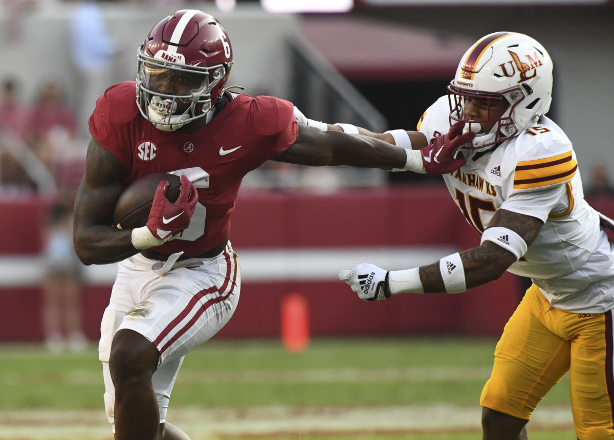 Alabama Crimson Tide running back Trey Sanders (6) is tackled by UL Monroe Warhawks defensive back Simion Hines (15) at Bryant-Denny Stadium. Sanders was called for an offensive face mask penalty.