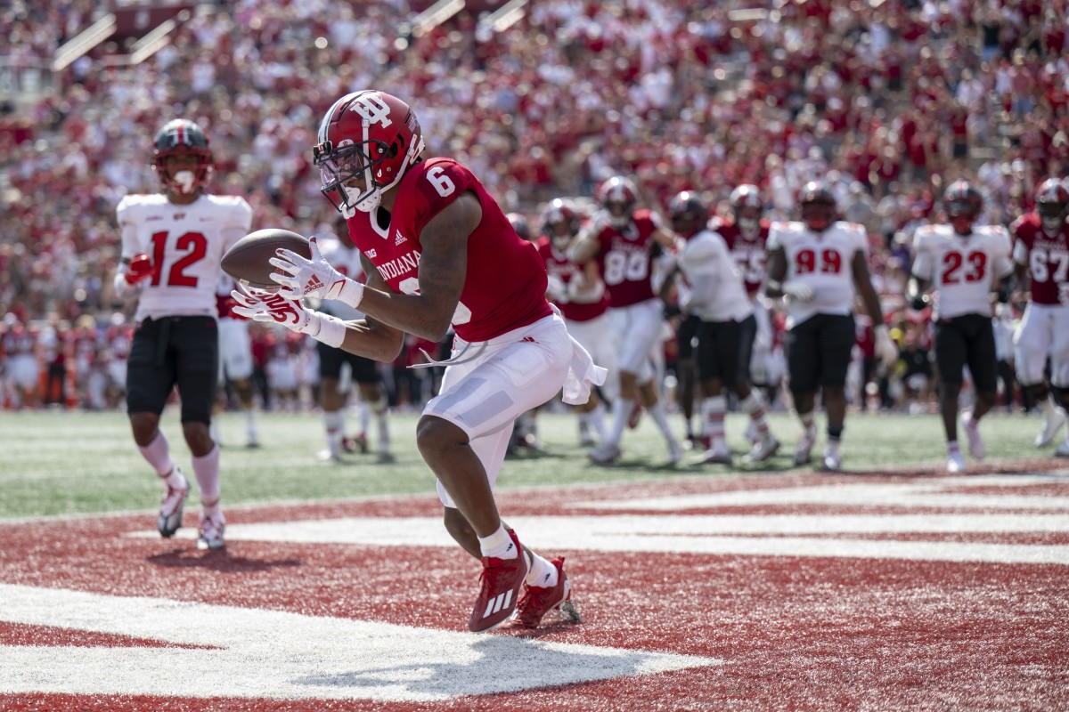 Indiana Hoosiers wide receiver Cam Camper (6) catches a ball for a touchdown in front of Western Kentucky Hilltoppers defensive back Kahlef Hailassie (12) during the second half at Memorial Stadium. Hoosiers won 33 to 30 in overtime.