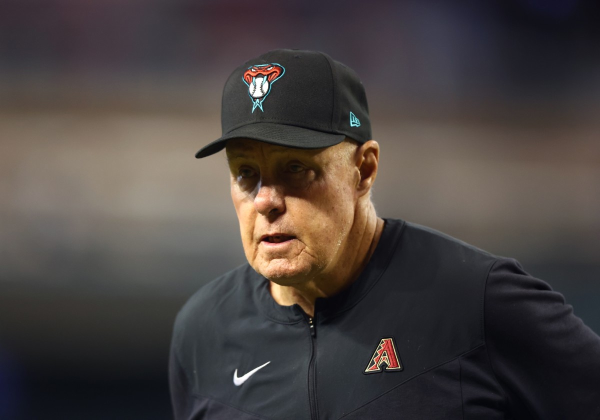 Brent Strom walks around Chase Field