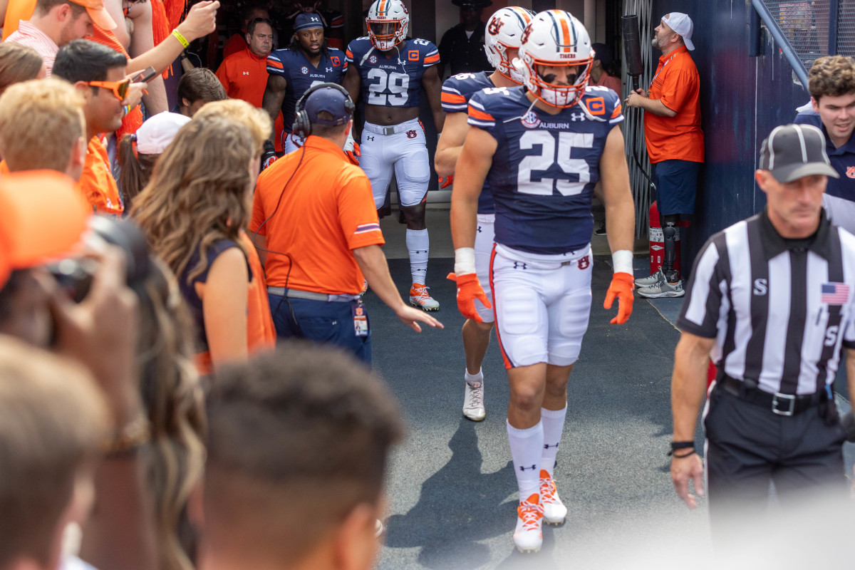 John Samuel Shenker approaching the field.