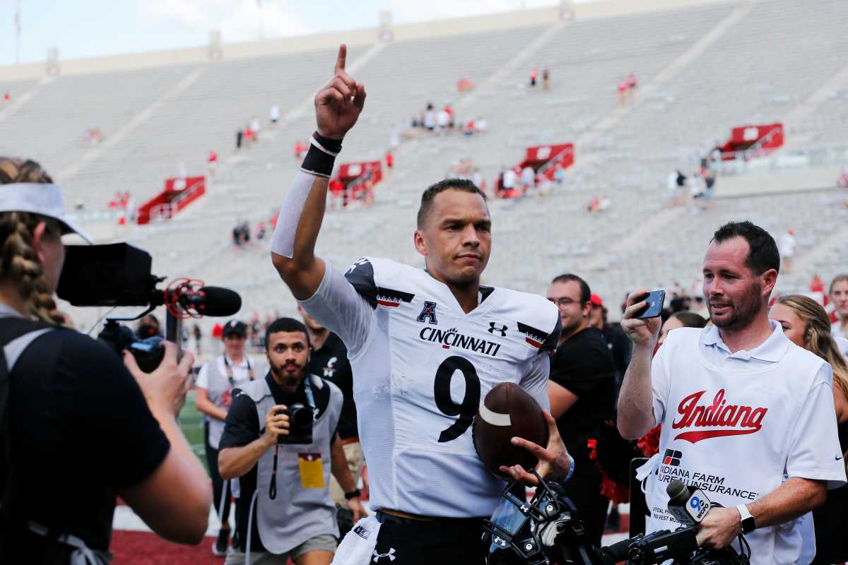 Cincinnati Bearcats quarterback Desmond Ridder (9) runs for the locker room after the Bearcats win in the fourth quarter of the NCAA football game between the Indiana Hoosiers and the Cincinnati Bearcats at Memorial Stadium in Bloomington, Ind., on Saturday, Sept. 18, 2021. The Bearcats won 38-24. Cincinnati Bearcats At Indiana Hoosiers Football