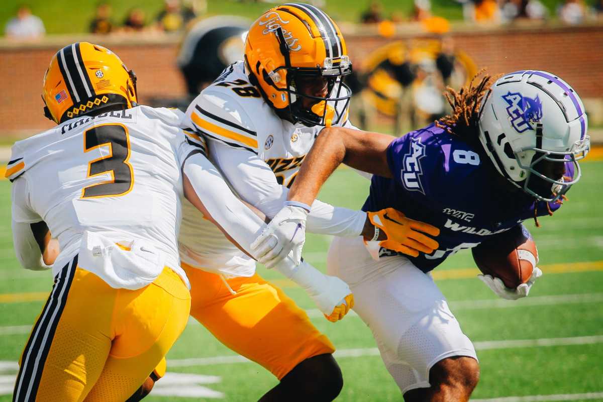 Abilene Christian wide receiver Kobe Clark is tackled by Missouri safety Joseph Charleston during a game against Abilene Christian on Sept. 17, 2022 at Faurot Field in Columbia.