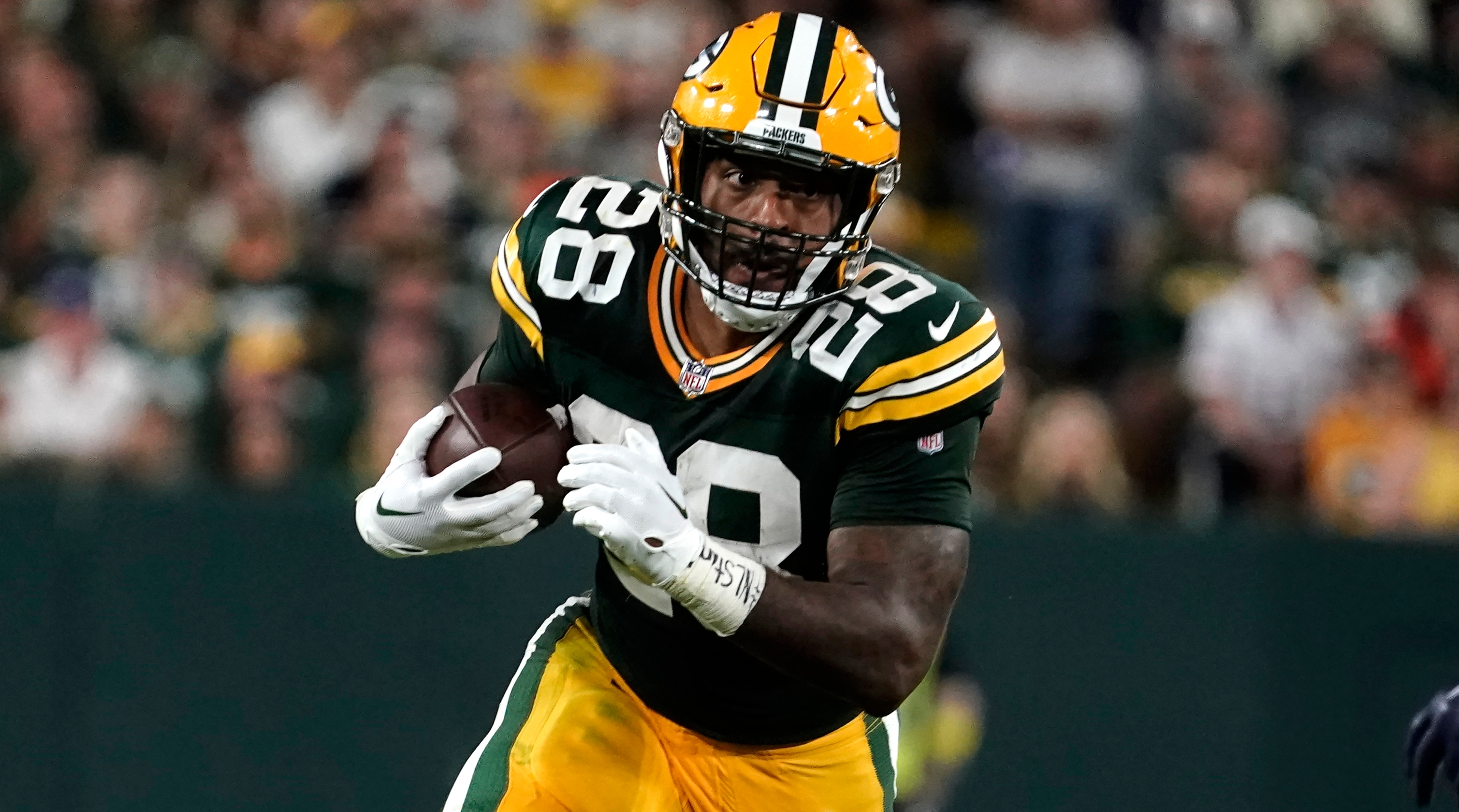 ASHWAUBENON, WI - AUGUST 05: Green Bay Packers running back AJ Dillon (28)  makes a catch during Green Bay Packers Family Night at Lambeau Field, on  August 5, 2022 in Green Bay