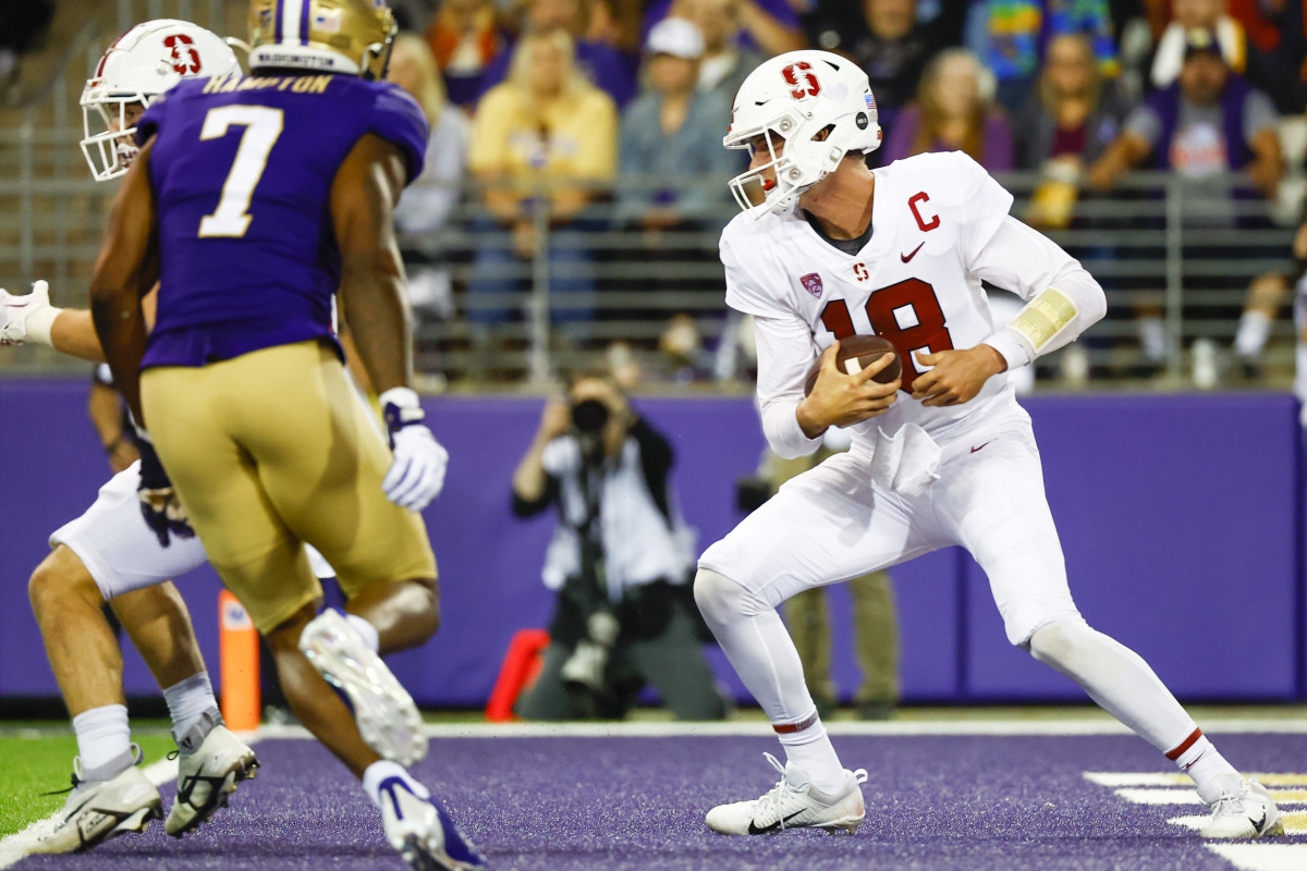 Stanford Cardinal quarterback Tanner McKee (18) rushes against the Washington Huskies during the second quarter at Alaska Airlines Field at Husky Stadium.