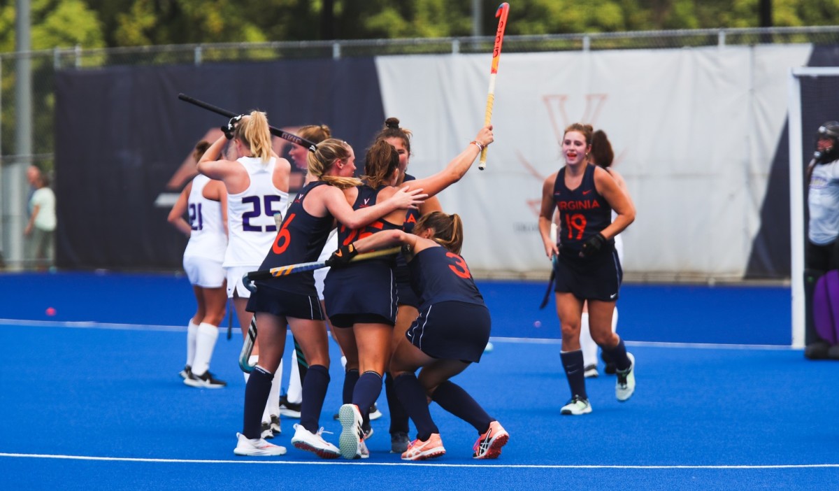 Noa Boterman celebrates with her teammates after scoring a goal for the Virginia Cavaliers field hockey team.