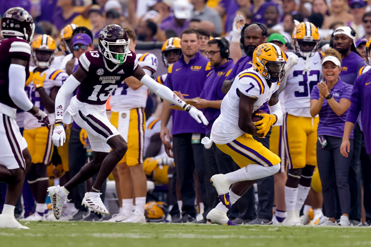 Sep 17, 2022; Baton Rouge, Louisiana, USA; LSU Tigers wide receiver Kayshon Boutte (7) catches a pass against Mississippi State Bulldogs cornerback Emmanuel Forbes (13) during the first half at Tiger Stadium. Mandatory Credit: Stephen Lew-USA TODAY Sports