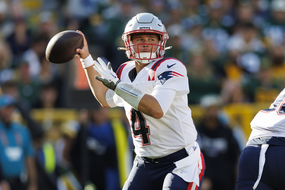 Oct 2, 2022; Green Bay, Wisconsin, USA; New England Patriots quarterback Bailey Zappe (4) throws a pass during the second quarter against the Green Bay Packers at Lambeau Field.