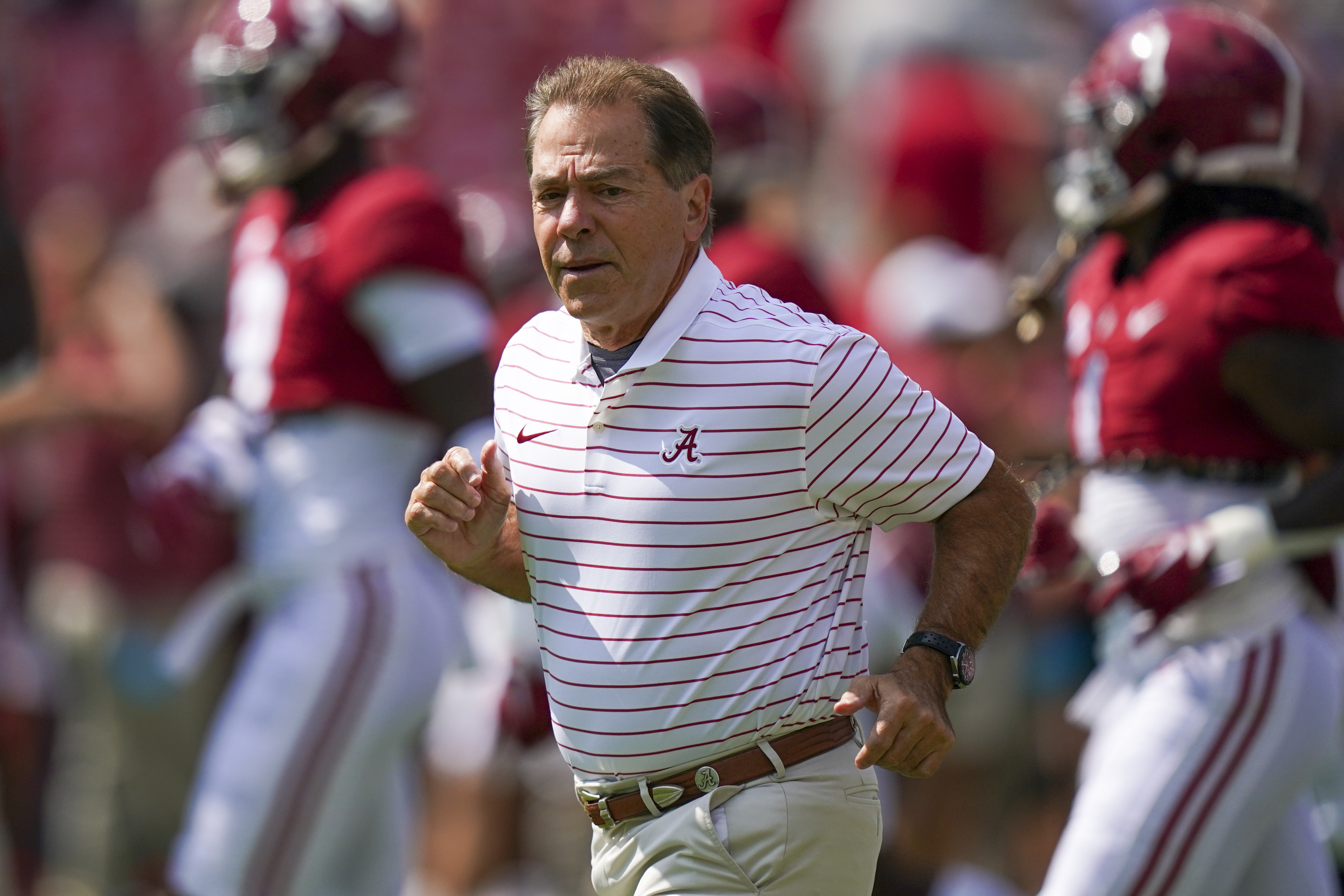 Alabama Crimson Tide head coach Nick Saban jogs on the field at Bryant-Denny Stadium in Tuscaloosa, Alabama.