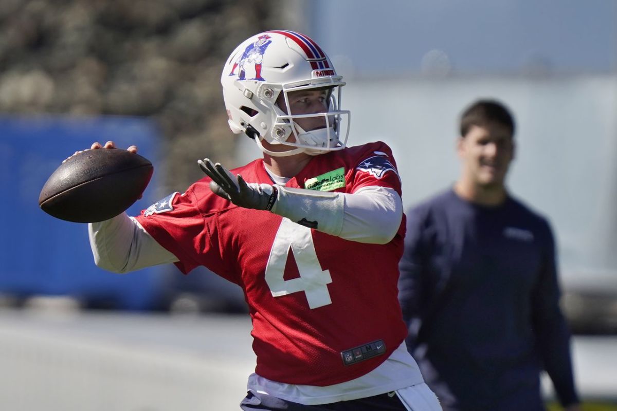 New England Patriots quarterback Bailey Zappe winds up to pass during an NFL football practice, Thursday, Oct. 6, 2022, in Foxborough, Mass.