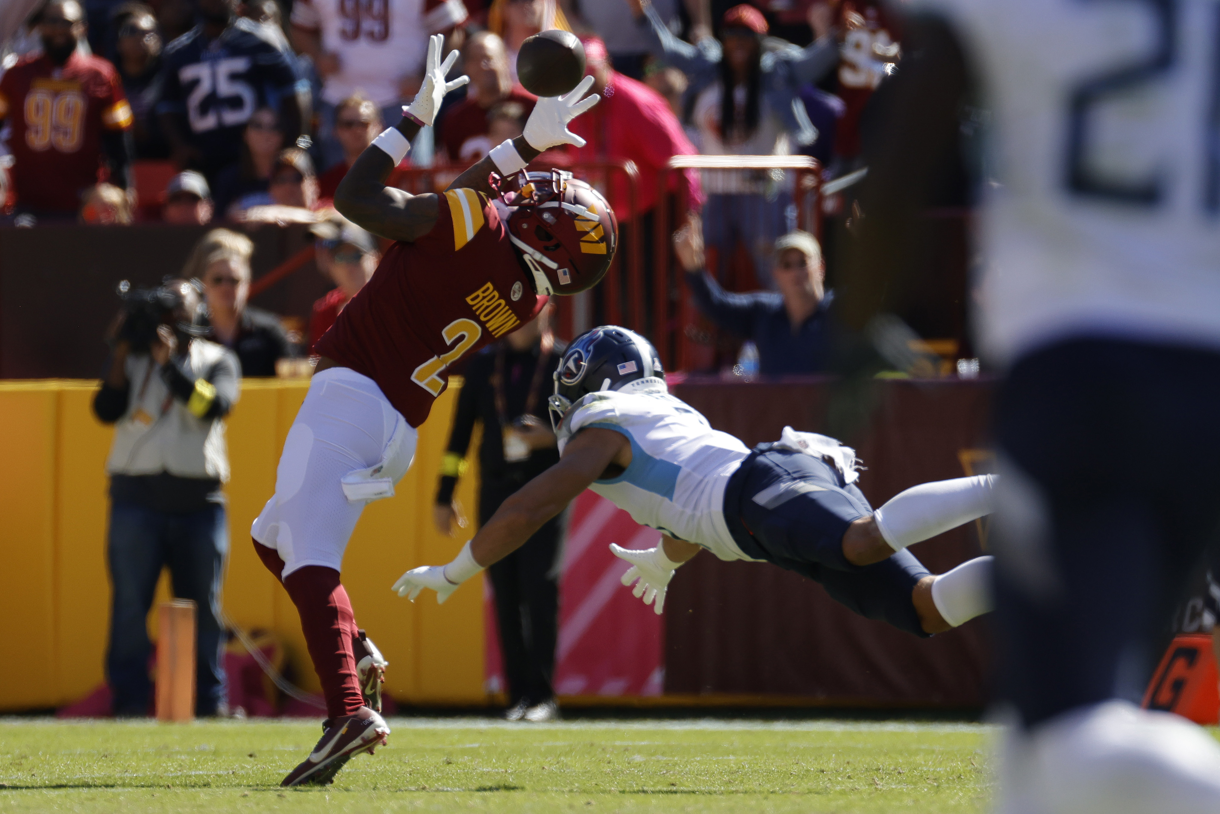 Landover, MD, USA. 8th Jan, 2023. Dallas Cowboys wide receiver KaVontae  Turpin (9) is tackled by Washington Commanders wide receiver Dyami Brown  (2) on the punt return during the game between the