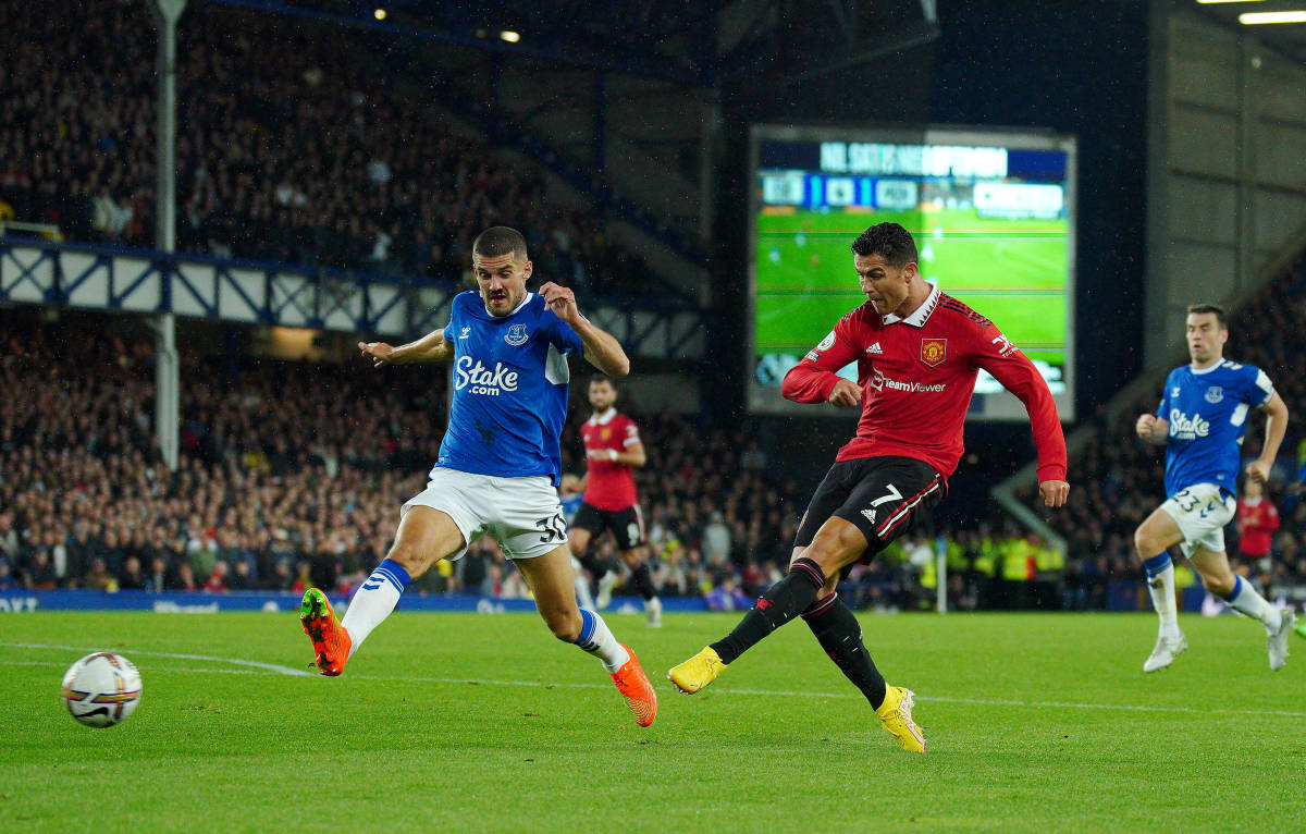 Cristiano Ronaldo pictured (no.7) shooting to score the 700th goal of his club career in Manchester United's 2-1 win over Everton in October 2022