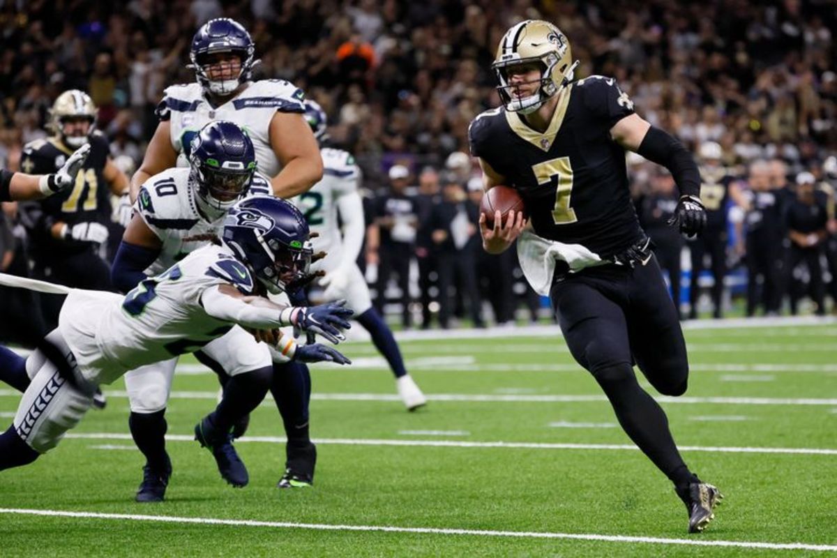 Taysom Hill of the New Orleans Saints rushes for a touchdown against the Seattle Seahawks. Credit: The Seattle Times