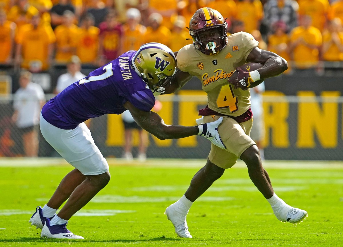 Dom Hampton moves in to tackle ASU's Daniyel Ngata.