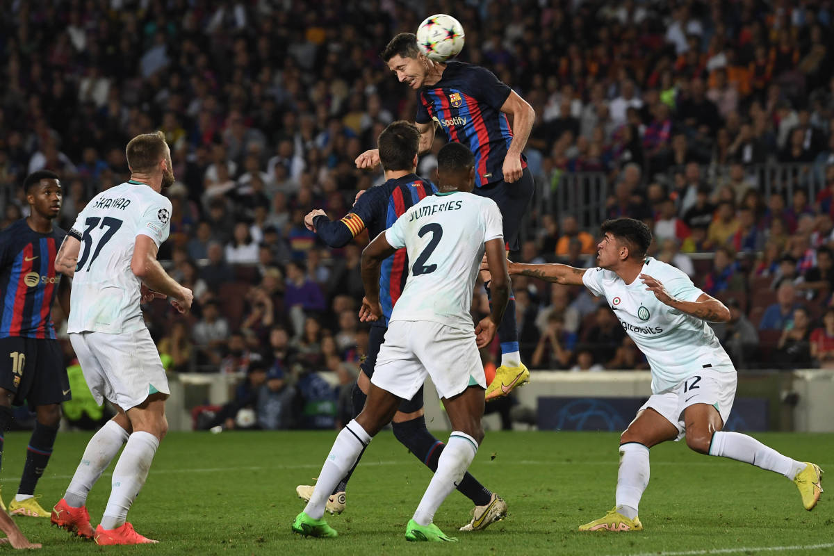 Robert Lewandowski pictured heading the ball to score during Barcelona's 3-3 draw with Inter Milan in October 2022