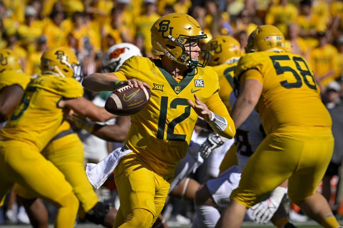 Oct 1, 2022; Waco, Texas, USA; Baylor Bears quarterback Blake Shapen (12) rolls out to pass against the Oklahoma State Cowboys during the second half at McLane Stadium.