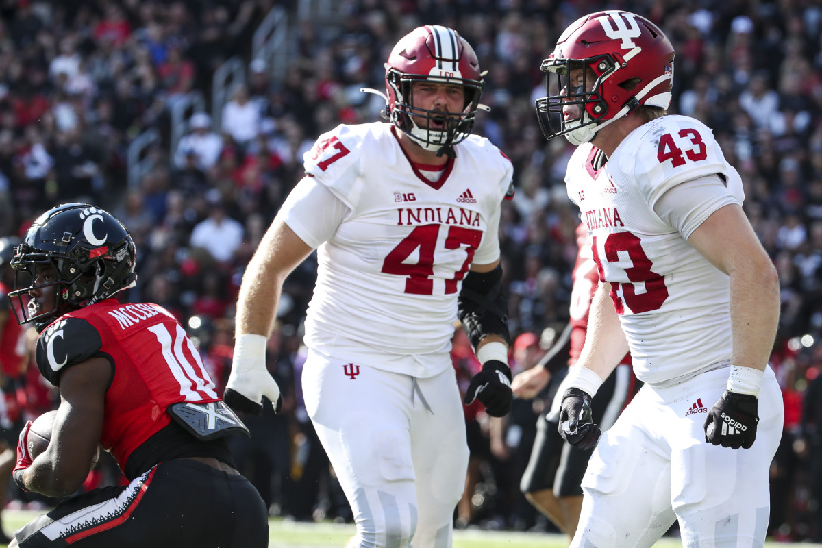 Indiana redshirt freshman linebacker Matt Hohlt (43) celebrates a tackle with JH Tevis (47) during Indiana's game against Cincinnati at Nippert Stadium on Sept. 24. 