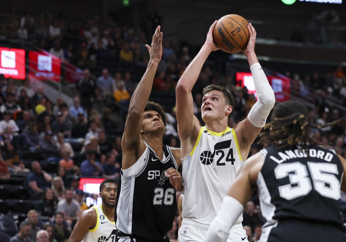 Utah Jazz center Walker Kessler (24) goes to the basket against San Antonio Spurs forward Dominick Barlow (26) in the fourth quarter at Vivint Arena.