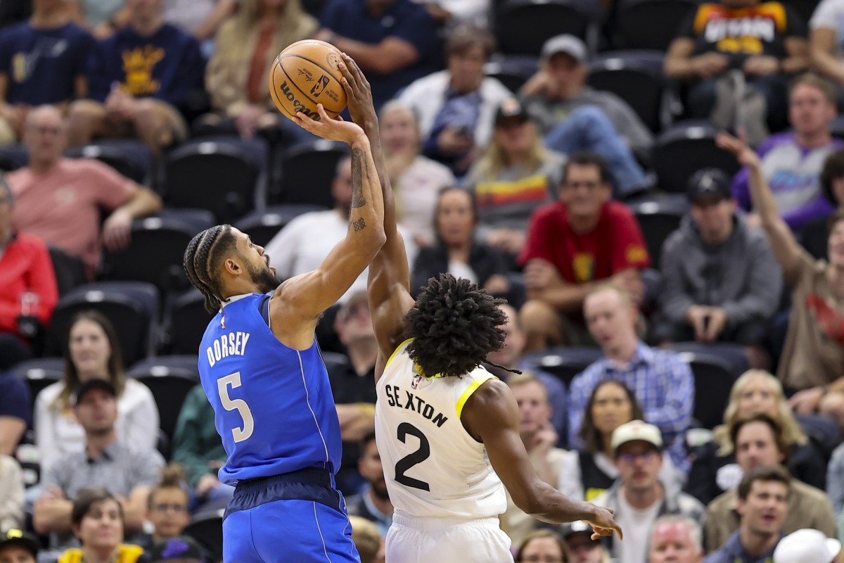 Dallas Mavericks guard Tyler Dorsey (5) has a shot blocked by Utah Jazz guard Collin Sexton (2) in the fourth quarter at Vivint Arena.