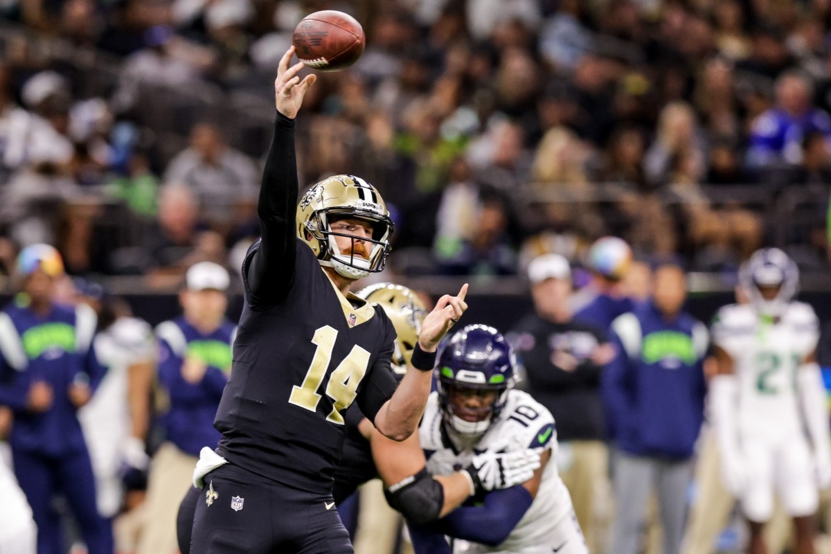 New Orleans Saints quarterback Andy Dalton (14) celebrates after