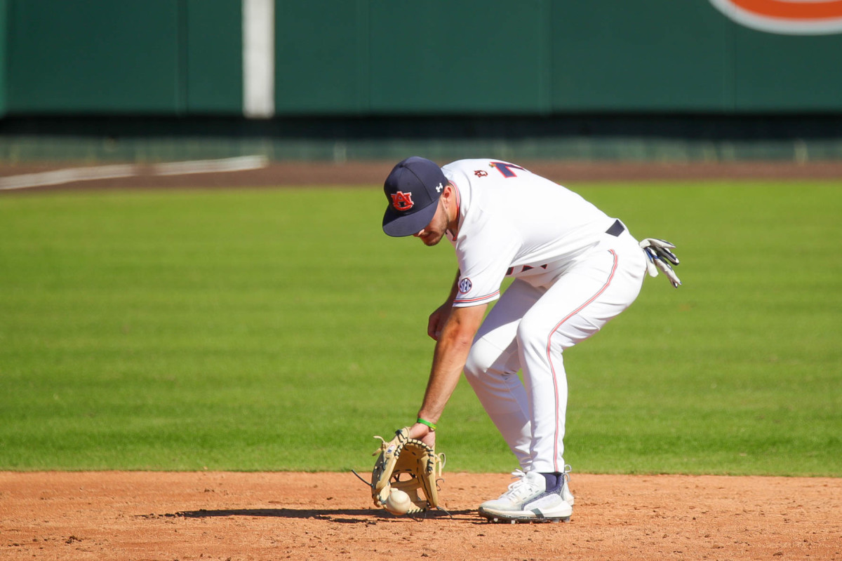 Cole Foster backhands a grounder at short against Louisiana Tech in fall exhibition action