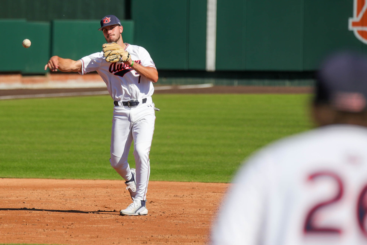 Cole Foster fires to first baseman Cooper McMurray against Louisiana Tech in fall exhibition action