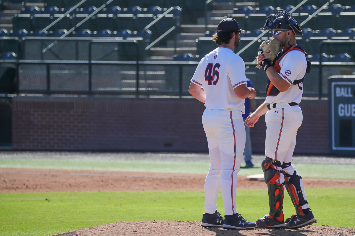 Chase Allsup (46) and Nate LaRue discuss strategy against Louisiana Tech in fall exhibition action