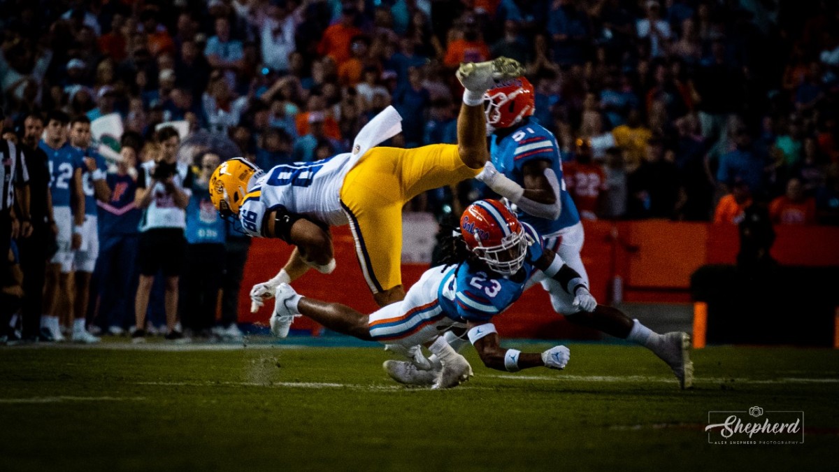 Florida cornerback Jaydon Hill tackles LSU tight end Mason Taylor on third down.