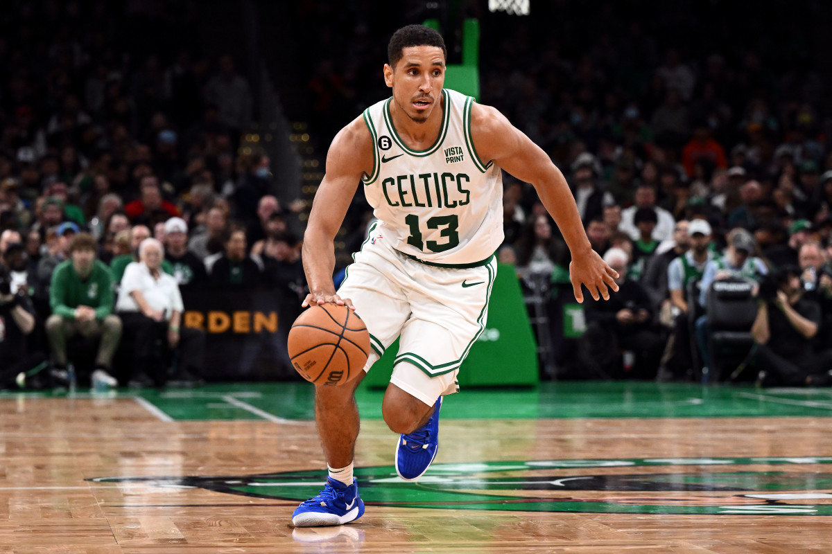 Boston Celtics guard Malcolm Brogdon (13) dribbles the ball during the second half of a game against the Toronto Raptors at the TD Garden.