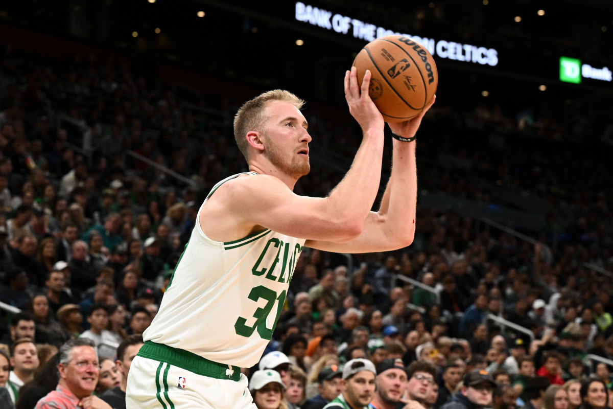 Boston Celtics forward Sam Hauser (30) attempts a three-point basket Toronto Raptors during the second half at the TD Garden.