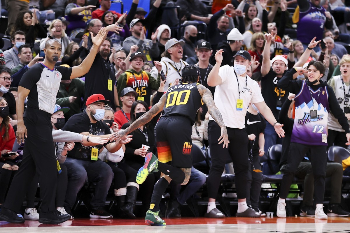 Utah Jazz guard Jordan Clarkson (00) reacts with fans after making a thee point basket in the third quarter against the Dallas Mavericks at Vivint Arena.