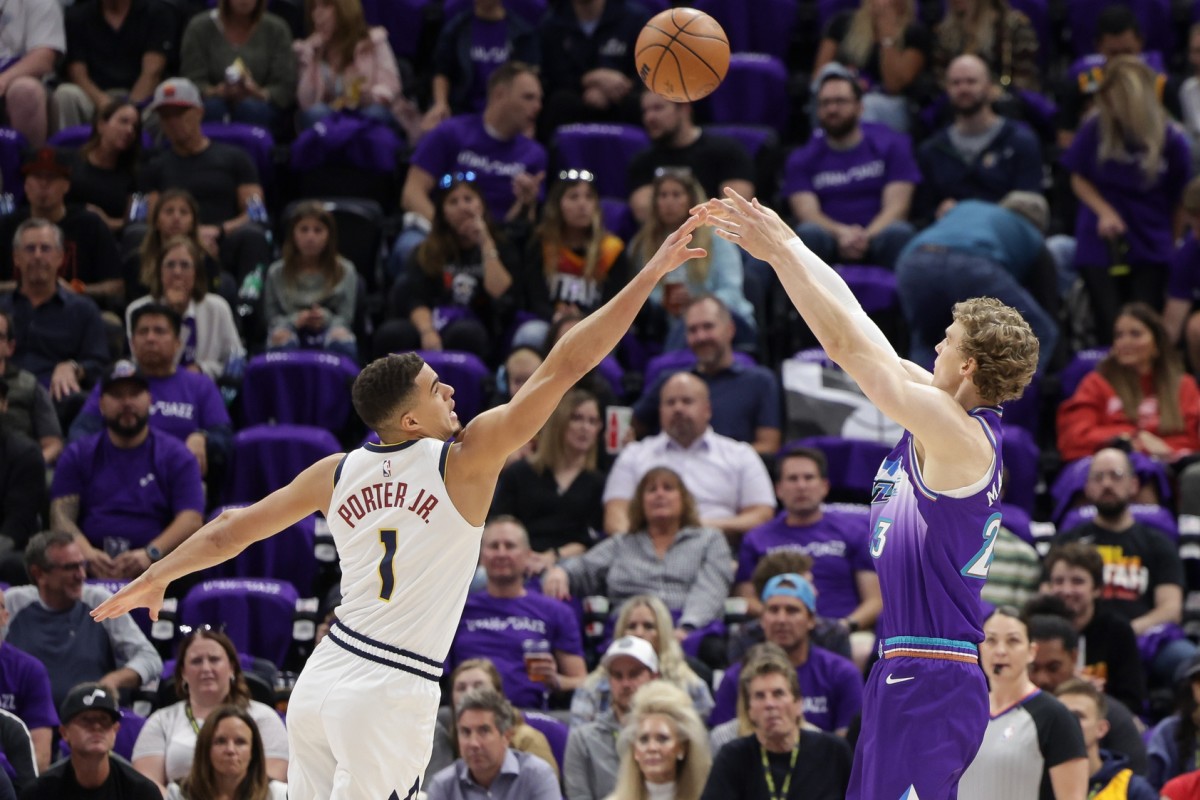 Utah Jazz forward Lauri Markkanen (23) shoots the ball over Denver Nuggets forward Michael Porter Jr. (1) during the first quarter at Vivint Arena.