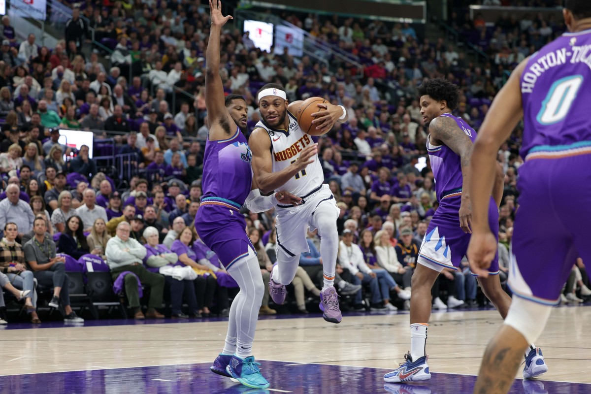 Denver Nuggets forward Bruce Brown (11) gets called for traveling after trying to get past Utah Jazz guard Malik Beasley (5) during the first quarter at Vivint Arena.