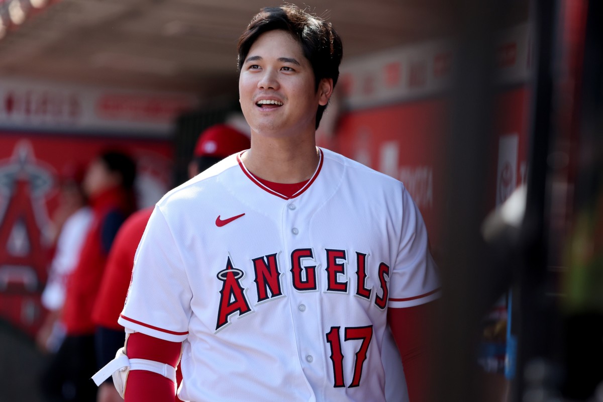 Los Angeles Angels' Mike Trout (27) smiles at Shohei Ohtani (17