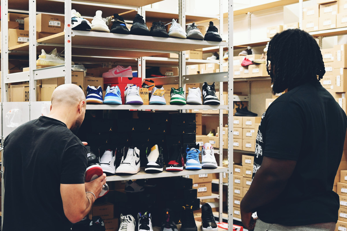 Mazi Smith scans selection of shoes at Sonny's in Novi (Mich.)