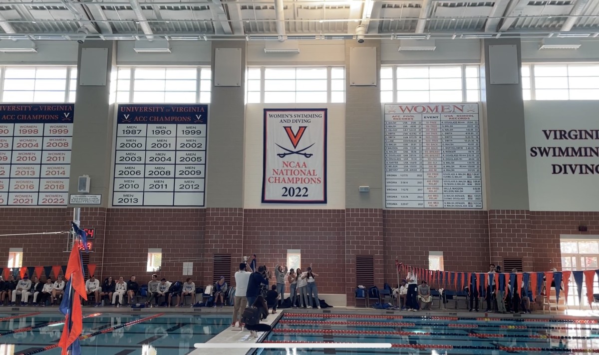 Virginia women’s swim & dive unveils the 2022 National Championship banner.