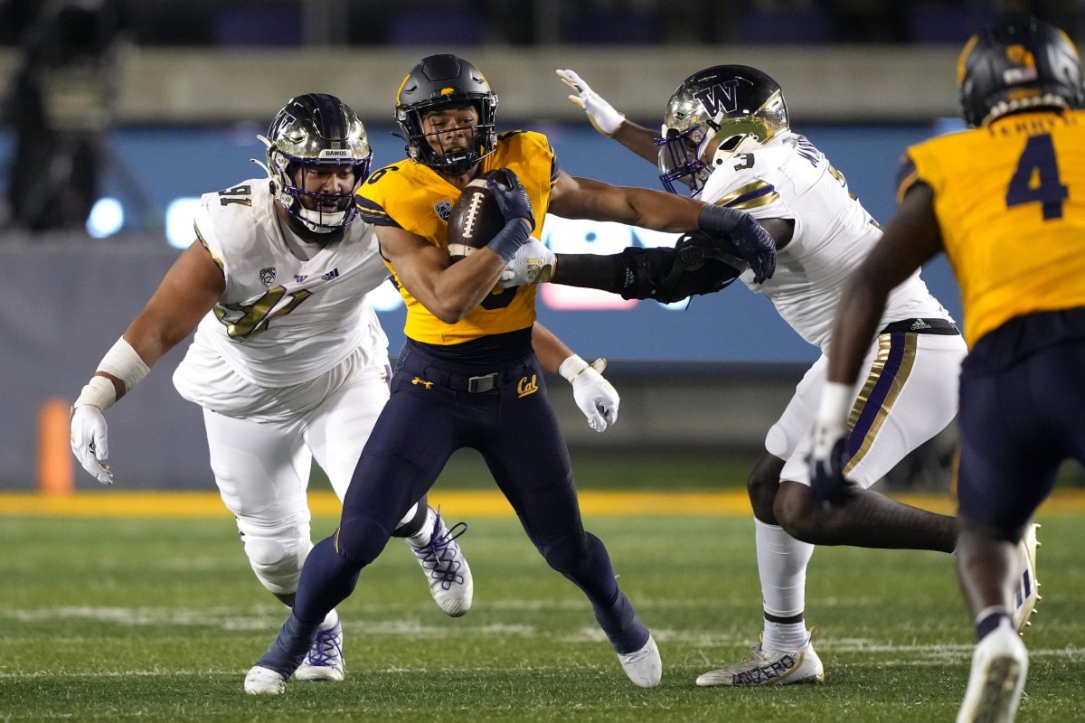 Tuli Letuligasenoa, a Bay Area native moves for the tackle on Cal running back Jadyn Ott.