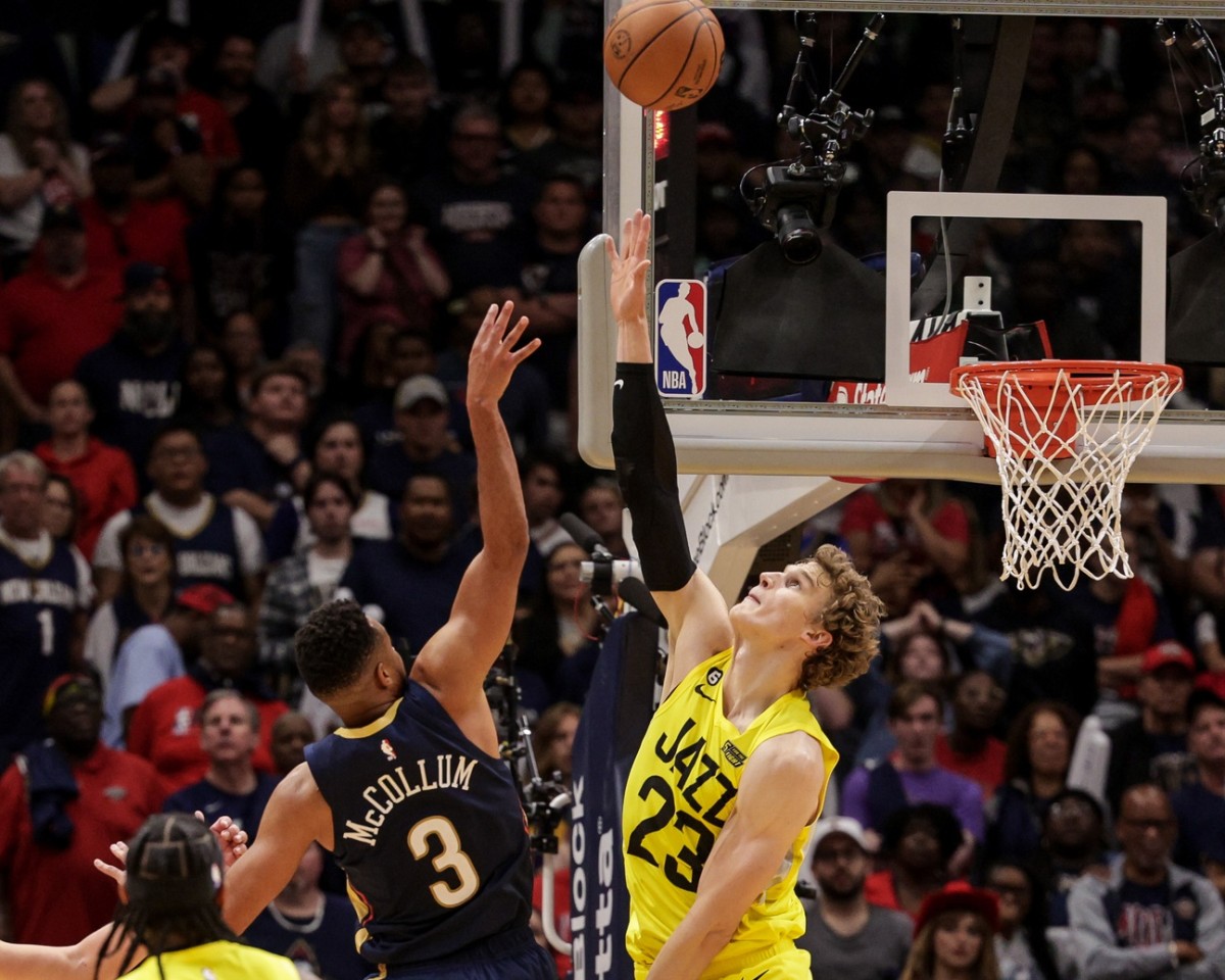 New Orleans Pelicans guard CJ McCollum (3) shoots a jump shot over Utah Jazz forward Lauri Markkanen (23) during over time at Smoothie King Center.