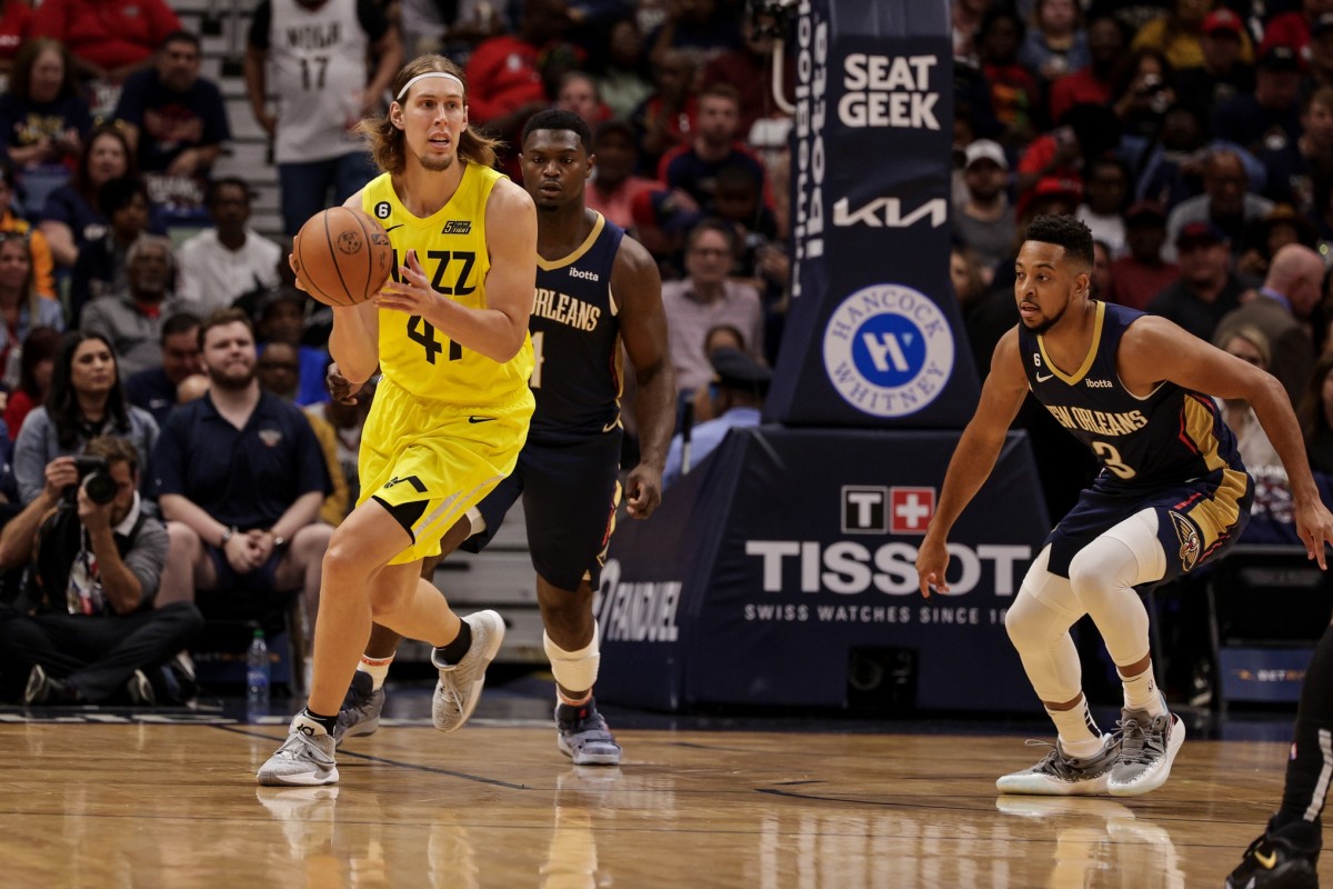 Utah Jazz forward Kelly Olynyk (41) passes against New Orleans Pelicans guard CJ McCollum (3) during the first half at Smoothie King Center.