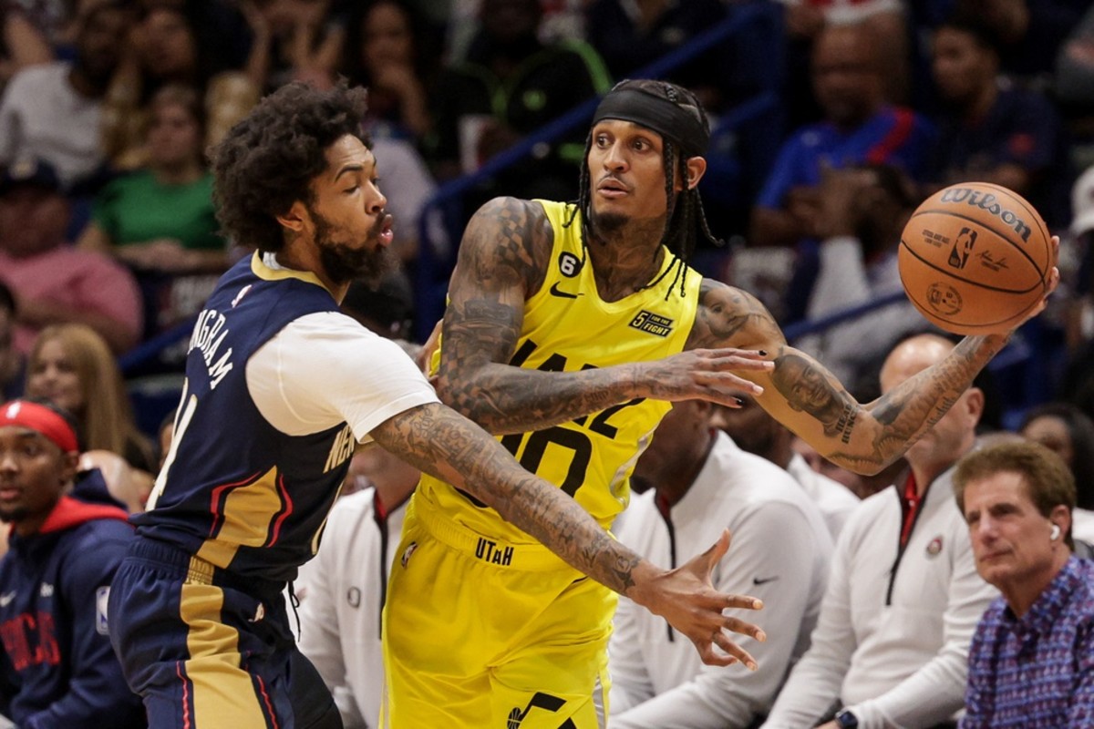 Utah Jazz guard Jordan Clarkson (00) looks to pass the ball against New Orleans Pelicans forward Brandon Ingram (14) during the first half at Smoothie King Center.