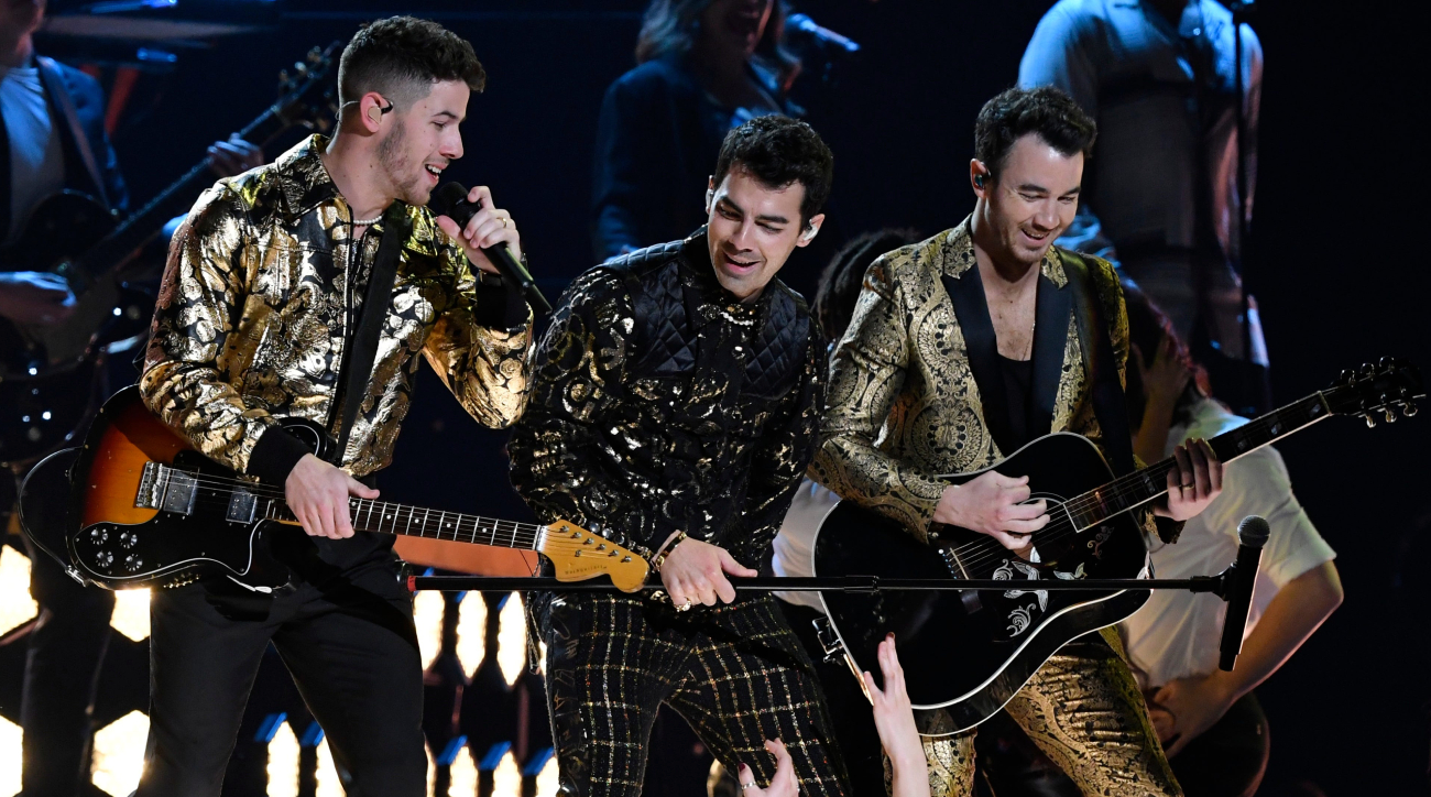 Joe Jonas, of the Jonas Brothers, performs during halftime of an