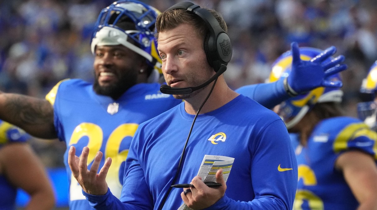 Rams head coach Sean McVay holds up his hands during a game against the Panthers.