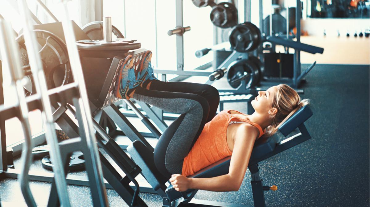Premium Photo  Muscular woman using the fitness equipment during