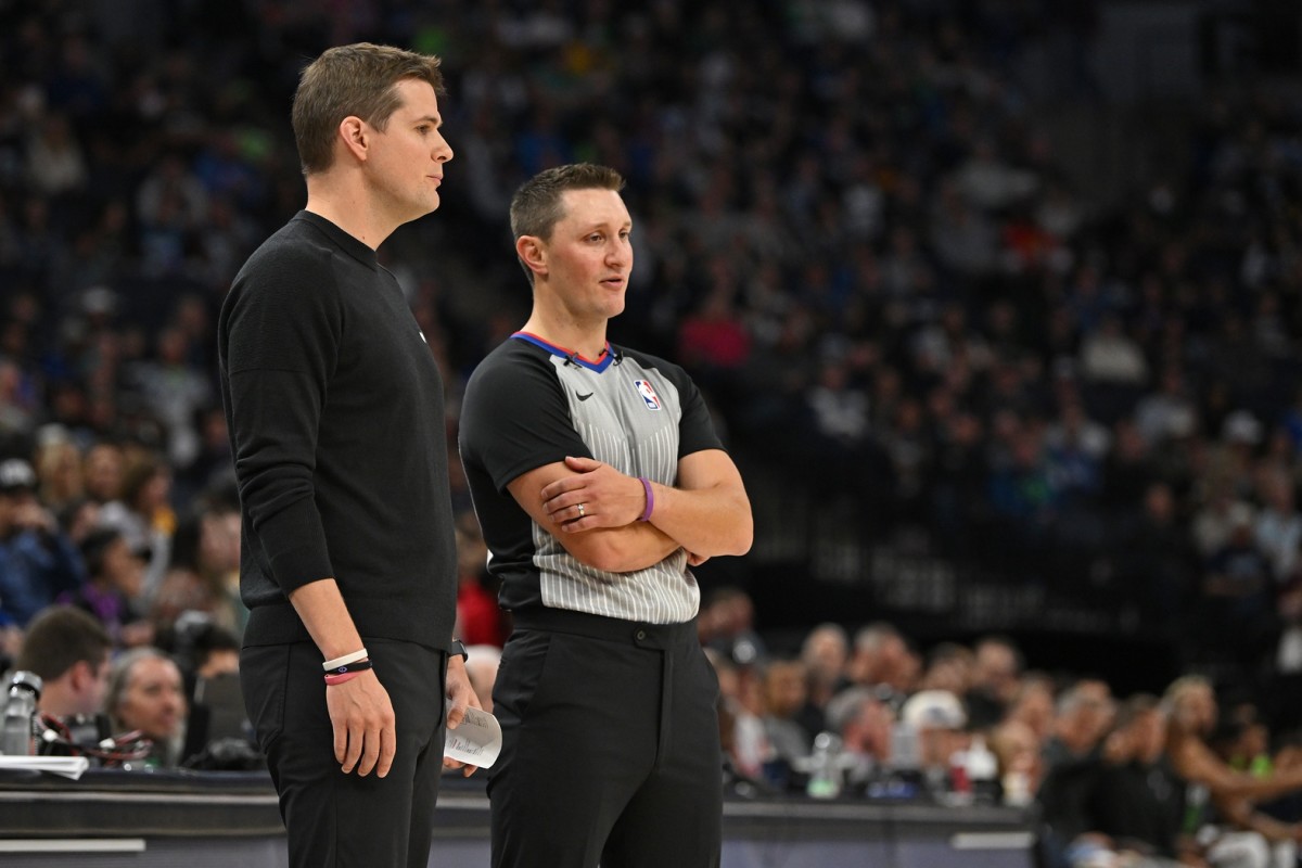 Utah Jazz head coach Will Hardy chats with referee JB DeRosa (22) during the second quarter at Target Center.