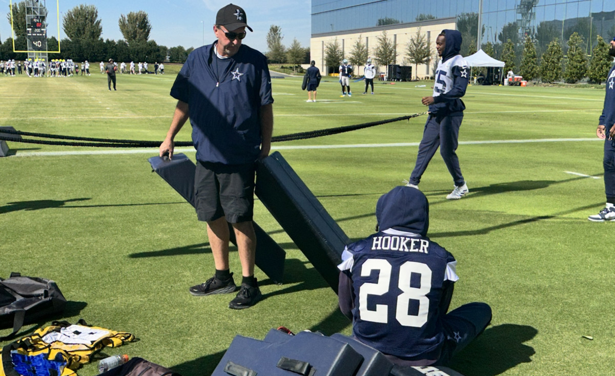 Dallas Cowboys running back Tony Pollard (20) and wide receiver CeeDee  Lamb, rear, greet each other during warmups before an NFL football game  aginst the Los Angeles Rams, Sunday, Oct. 9, 2022