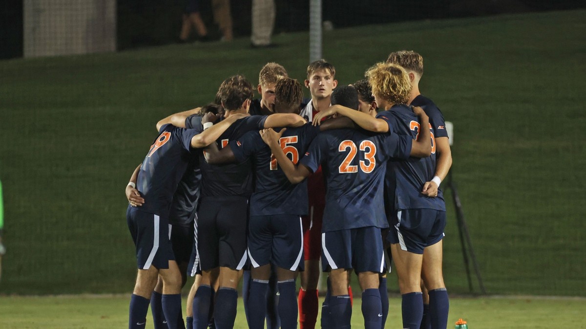 The Virginia Cavaliers men's soccer team huddles during the game against Xavier at Klockner Stadium.