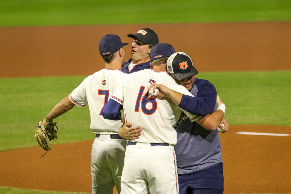 Cole Foster and Cam Hill greet for Auburn baseball standout Sonny DiChiara.