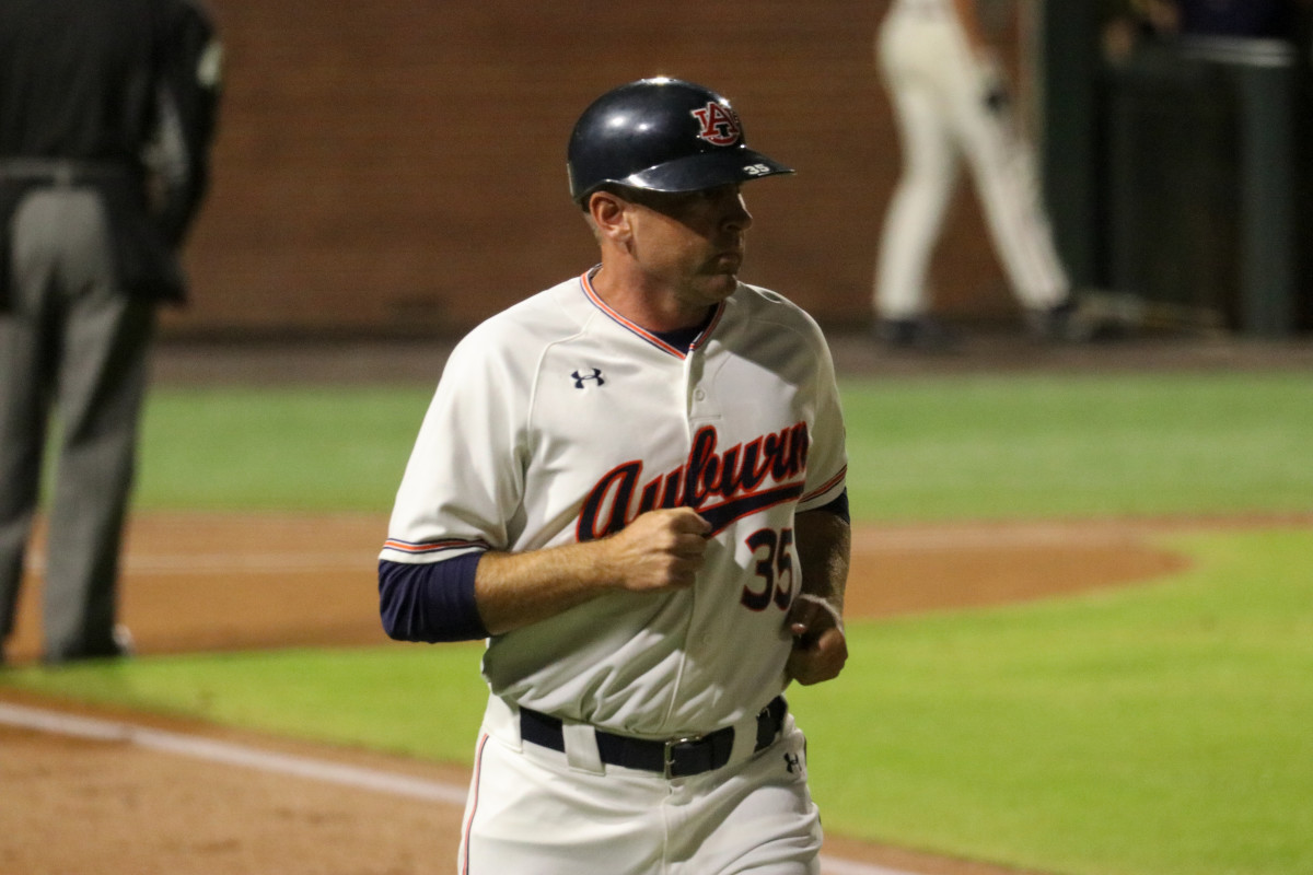 Karl Nonemaker runs to coach first base for Auburn baseball vs Alabama.