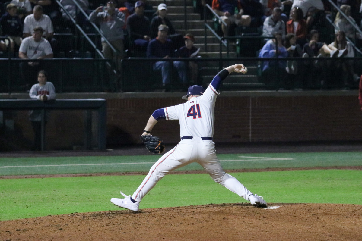 Auburn baseball's John Armstrong throws a pitch vs Alabama.