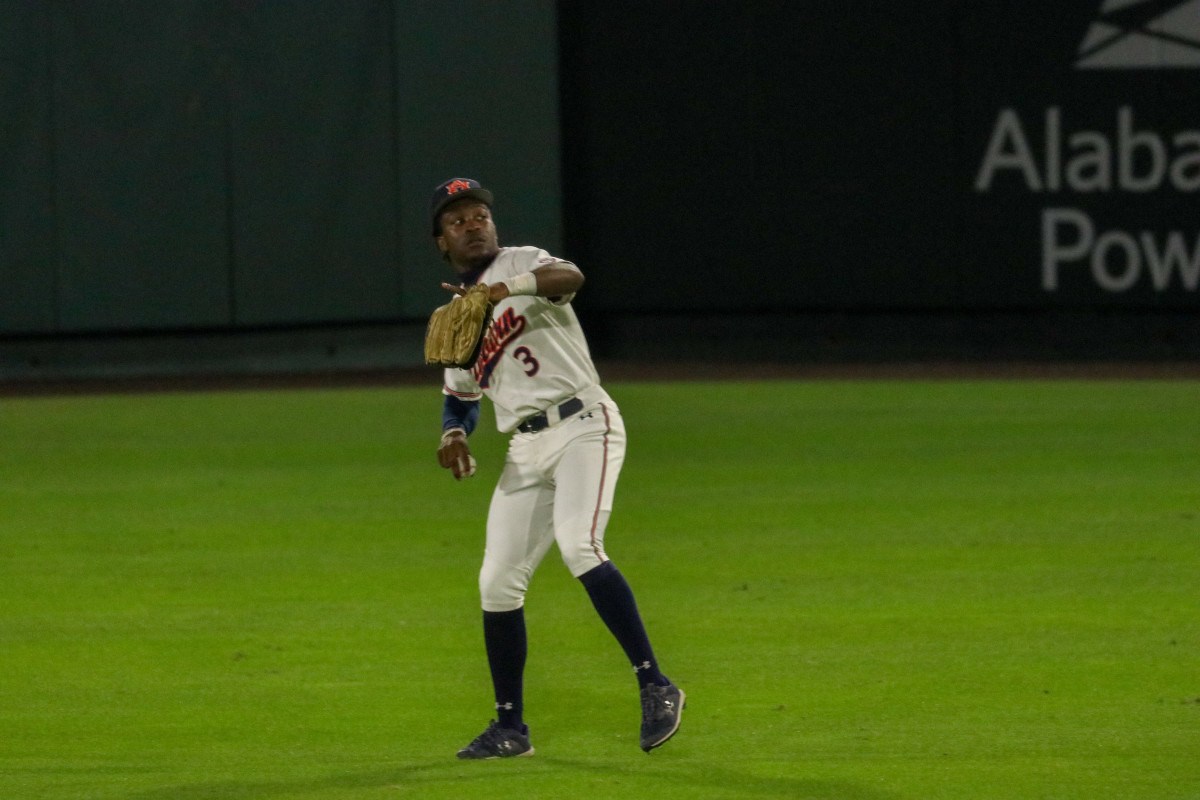 Chris Stanfield playing center field for Auburn baseball.